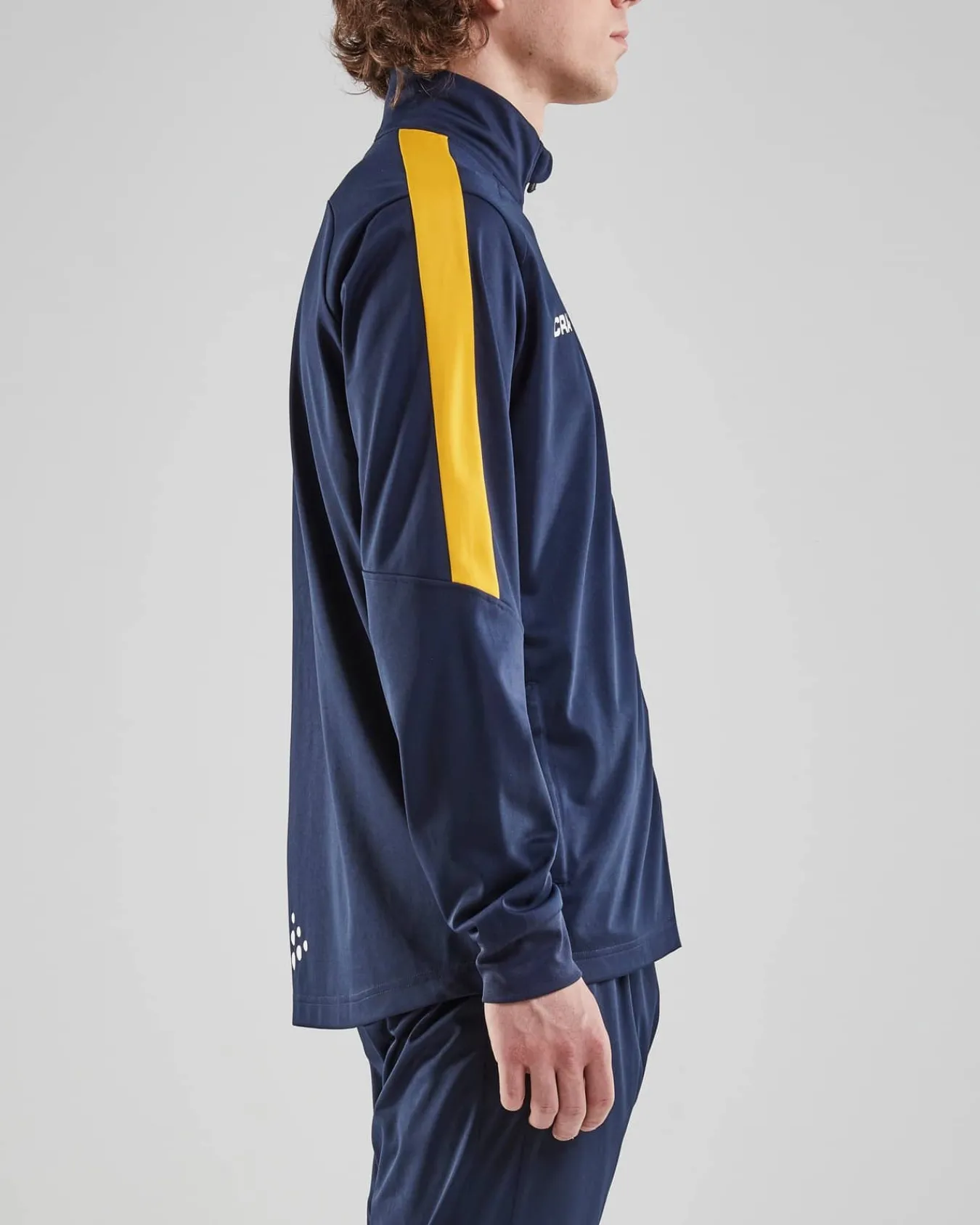 Craft Sportswear Teamwear^Progress Jacket M Navy/Sweden Yellow