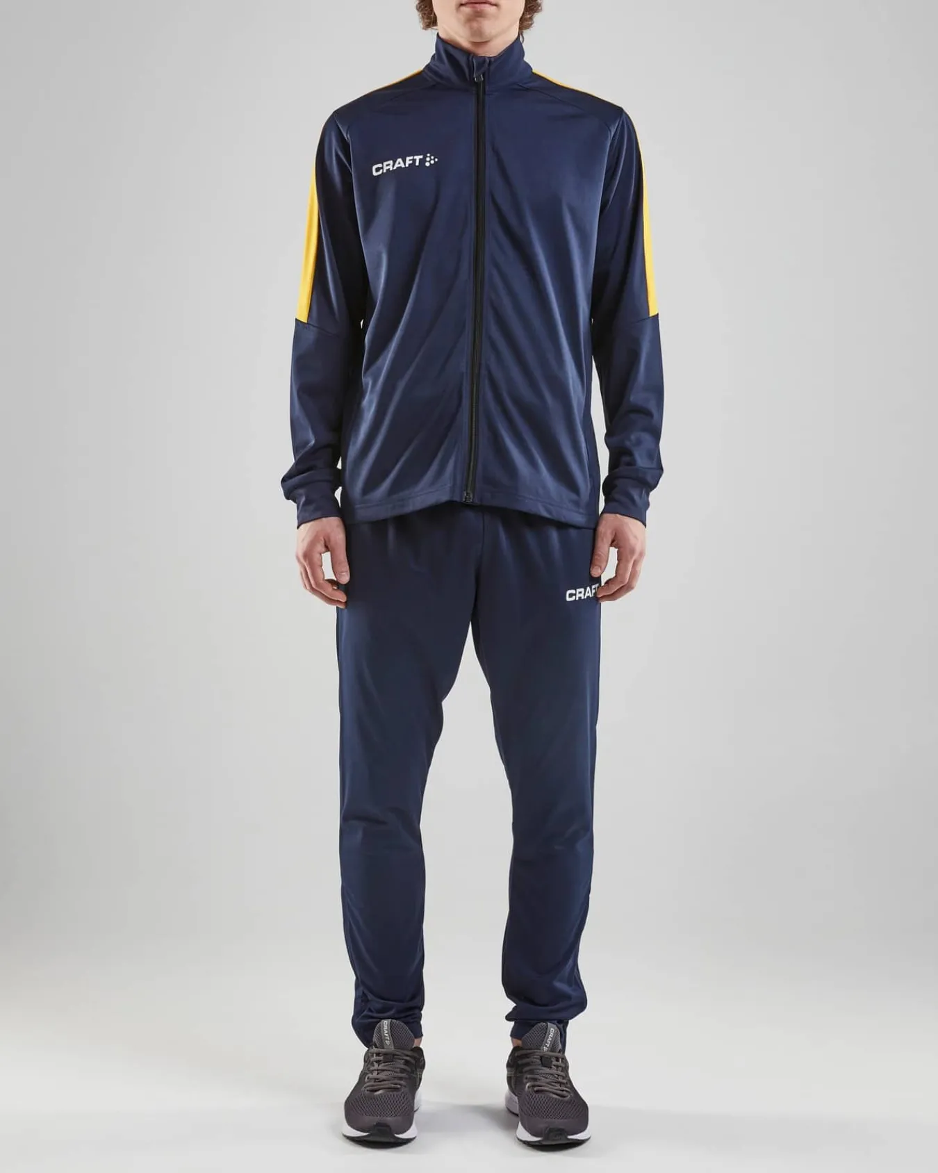 Craft Sportswear Teamwear^Progress Jacket M Navy/Sweden Yellow